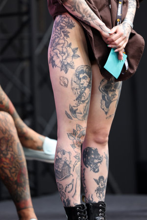 Krakow, Poland - June 11, 2022: Unidentified participant during the contest for the best tattoo at the 15th Tattoofest Convention in Cracow. One of the most prestigious tattoo festivals.のeditorial素材