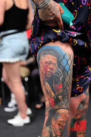 Krakow, Poland - June 12, 2022: Unidentified participant during the contest for the best tattoo at the 15th Tattoofest Convention in Cracow. One of the most prestigious tattoo festivals.のeditorial素材