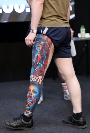 Krakow, Poland - June 12, 2022: Unidentified participant during the contest for the best tattoo at the 15th Tattoofest Convention in Cracow. One of the most prestigious tattoo festivals.のeditorial素材