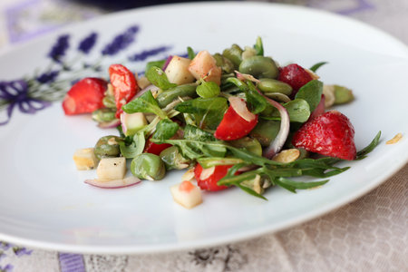 salad with strawberries and broad beans. Delicious dish in a healthy styleの写真素材