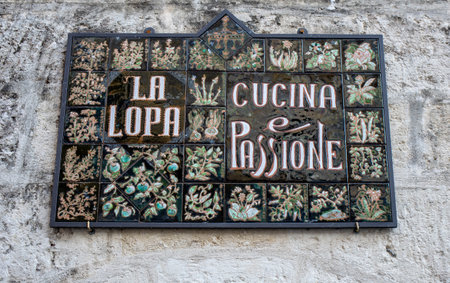 Matera, Italy - September 15, 2019: Original signboards for cafes and restaurants in Sassi di Matera, Matera. Basilicata, Italyのeditorial素材