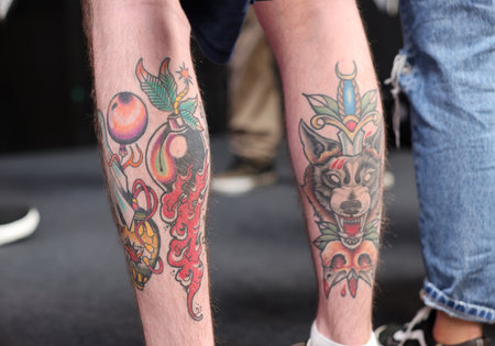 Krakow, Poland - June 11, 2022: Unidentified participant during the contest for the best tattoo at the 15th Tattoofest Convention in Cracow. One of the most prestigious tattoo festivals.のeditorial素材