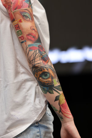 Krakow, Poland - June 12, 2022: Unidentified participant during the contest for the best tattoo at the 15th Tattoofest Convention in Cracow. One of the most prestigious tattoo festivals.のeditorial素材