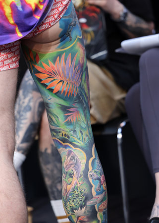 Krakow, Poland - June 12, 2022: Unidentified participant during the contest for the best tattoo at the 15th Tattoofest Convention in Cracow. One of the most prestigious tattoo festivals.のeditorial素材