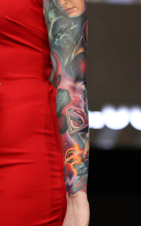 Krakow, Poland - June 12, 2022: Unidentified participant during the contest for the best tattoo at the 15th Tattoofest Convention in Cracow. One of the most prestigious tattoo festivals.のeditorial素材