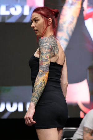 Krakow, Poland - June 11, 2022: Unidentified participant during the contest for the best tattoo at the 15th Tattoofest Convention in Cracow. One of the most prestigious tattoo festivals.のeditorial素材