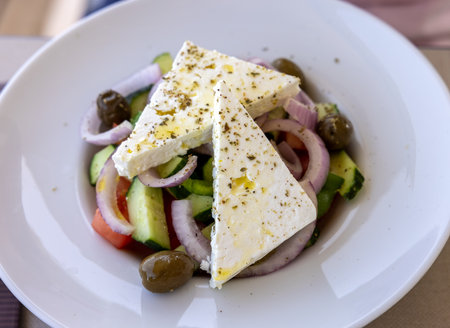 Greek salad with feta cheese. Typical delicious greek style lunchの写真素材