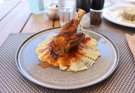 Braised lamb shank on the mashed potatoの写真素材