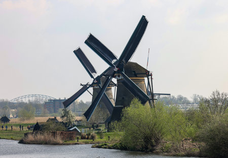 Kinderdijk, the Netherlands - April 17, 2023: 19 windmills at Kinderdijk built about 1740 is part of a larger water management system to prevent flooding. A UNESCO world heritage site.のeditorial素材