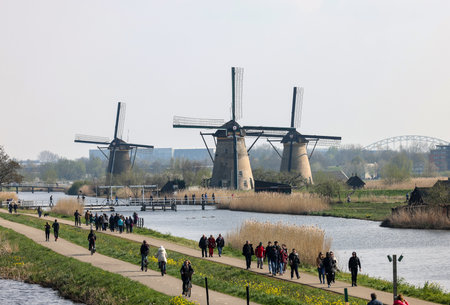 Kinderdijk, the Netherlands - April 17, 2023: 19 windmills at Kinderdijk built about 1740 is part of a larger water management system to prevent flooding. A UNESCO world heritage site.のeditorial素材