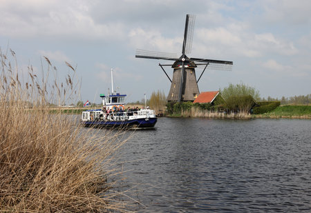Kinderdijk, the Netherlands - April 17, 2023: 19 windmills at Kinderdijk built about 1740 is part of a larger water management system to prevent flooding. A UNESCO world heritage site.のeditorial素材