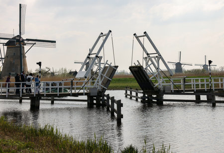 Kinderdijk, the Netherlands - April 17, 2023: 19 windmills at Kinderdijk built about 1740 is part of a larger water management system to prevent flooding. A UNESCO world heritage site.のeditorial素材