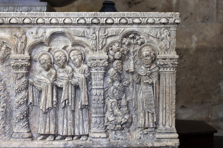 Massa Marittima, Italy - Sept 11, 2022: Monumental baptismal font, with a rectangular bath surmounted by a small temple. The baptistery dates from 1267. Cathedral of Saint Cerbonius in Massa Marittima. Italyのeditorial素材
