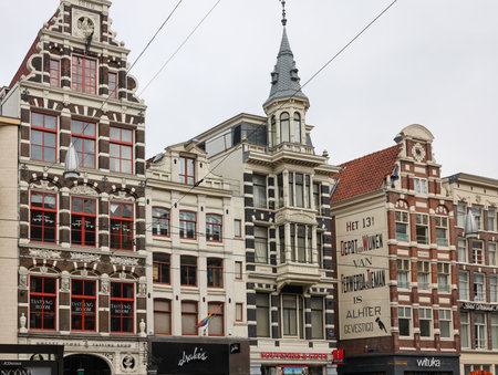Amsterdam, Netherlands - April 21, 2023: Typical gabled houses on Damrak street in Amsterdam, Holland, Netherlandsのeditorial素材
