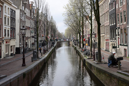Amsterdam, Netherlands - April 21, 2023: De Wallen - called the red light district. It is famous for its entertainment character: brothers, coffee shops, pubs and restaurants located along the canalsのeditorial素材