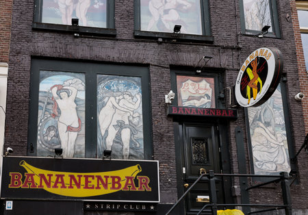 Amsterdam, Netherlands - April 21, 2023: Strip club with live sex shows in De Wallen called the red light district famous for its entertainment character: brothels, coffee shops, pubs and restaurantsのeditorial素材