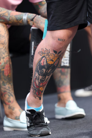 Krakow, Poland - June 11, 2022: Unidentified participant during the contest for the best tattoo at the 15th Tattoofest Convention in Cracow. One of the most prestigious tattoo festivals.のeditorial素材