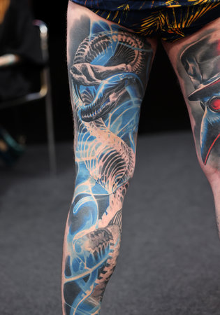 Krakow, Poland - June 12, 2022: Unidentified participant during the contest for the best tattoo at the 15th Tattoofest Convention in Cracow. One of the most prestigious tattoo festivals.のeditorial素材