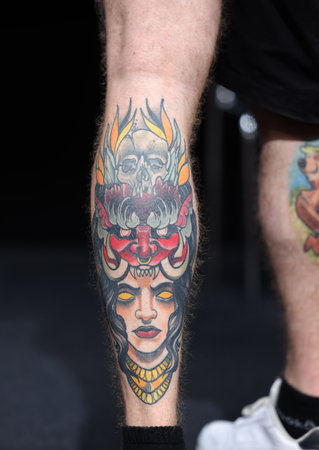 Krakow, Poland - June 11, 2022: Unidentified participant during the contest for the best tattoo at the 15th Tattoofest Convention in Cracow. One of the most prestigious tattoo festivals.のeditorial素材