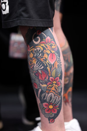 Krakow, Poland - June 11, 2022: Unidentified participant during the contest for the best tattoo at the 15th Tattoofest Convention in Cracow. One of the most prestigious tattoo festivals.のeditorial素材