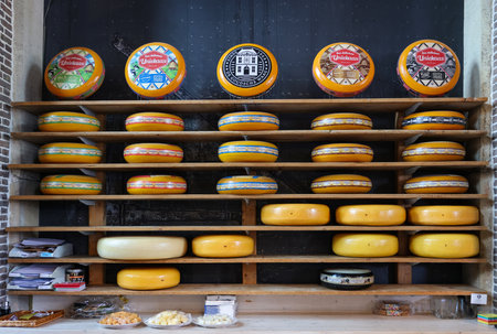 Gouda, the Nehterlands - April 20, 2023: Display of traditional Dutch cheese at local cheese shop in Gouda, the Netherlandsのeditorial素材