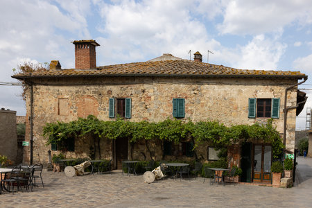 Monteriggioni, Italy - Sept 17, 2022: Restaurant in Piazza Roma in Monteriggioni medieval walled town near Siena in Tuscany, Italyのeditorial素材