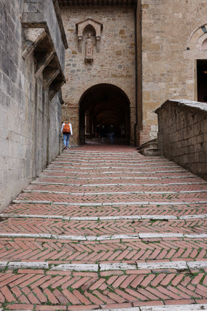 San Gimignano, Italy - Sept 17, 2022: Entrance to the Courtyard of Palazzo Comunale, also known as the Palazzo del Popolo in San Gimignano. Tuscany, Italyのeditorial素材