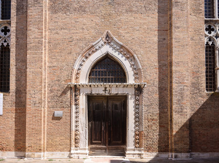 Ornate doorway and facade of the church of San Gregorio, Venice, Italyの写真素材