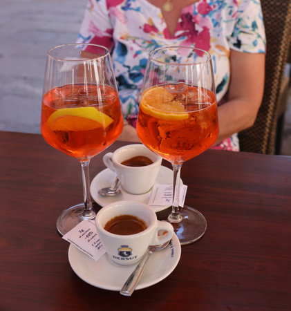 Venice, Italy - September 5, 2022: Two espressos and two Aperol Spritz - time to relax in Venice. Italyのeditorial素材