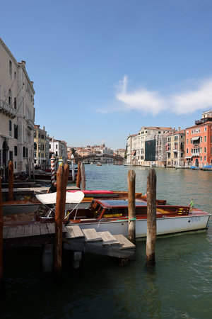 Venice, Italy - September 5, 2022: Wooden mooring pole at Canal Grande in Venice. Italyのeditorial素材