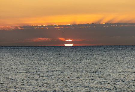 Sunrise over the Mediterranean Sea seen from the beach in Torremolinos. Costa del Sol, Spainの写真素材