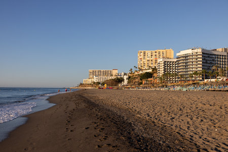 Torremolinos, Spain - September 12, 2023: View of Bajondillo Beach and hotels in Torremolinos at sunrise. Costa del Sol, Spain.のeditorial素材