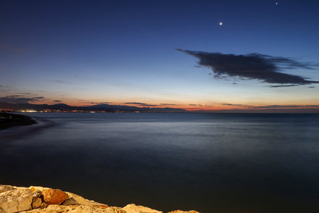 View from Torremolinos towards Malaga just before sunrise. Costa del Sol, Spain.の写真素材