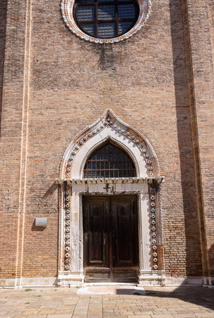 Ornate doorway and facade of the church of San Gregorio, Venice, Italyの写真素材