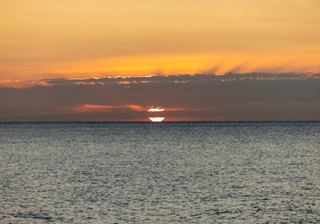 Sunrise over the Mediterranean Sea seen from the beach in Torremolinos. Costa del Sol, Spainの写真素材