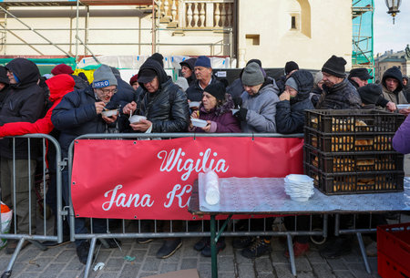 Krakow, Poland - Dec 17, 2023: Christmas Eve for the poor and homeless on the Main Square in Cracow. The group Kosciuszko prepares the greatest eve in the open air in Krakowのeditorial素材