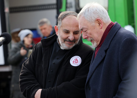 Krakow, Poland - Dec 17, 2023: Priest Tadeusz Isakowicz-Zaleski and Jacek Majchrowski at the Main Square during the Christmas Eve for poor and homelessのeditorial素材