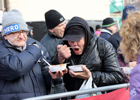 Krakow, Poland - Dec 17, 2023: Christmas Eve for the poor and homeless on the Main Square in Cracow. The group Kosciuszko prepares the greatest eve in the open air in Krakowのeditorial素材