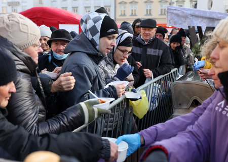 Krakow, Poland - Dec 17, 2023: Christmas Eve for the poor and homeless on the Main Square in Cracow. The group Kosciuszko prepares the greatest eve in the open air in Krakowのeditorial素材