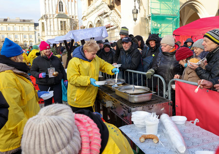 Krakow, Poland - Dec 17, 2023: Christmas Eve for the poor and homeless on the Main Square in Cracow. The group Kosciuszko prepares the greatest eve in the open air in Krakowのeditorial素材