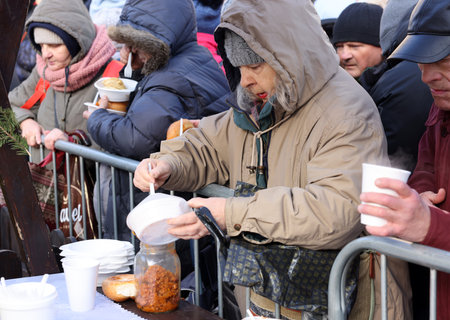 Krakow, Poland - Dec 17, 2023: Christmas Eve for the poor and homeless on the Main Square in Cracow....