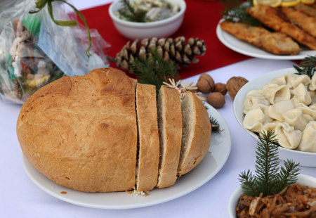 Christmas food on the table decorating with a white tableclothの写真素材
