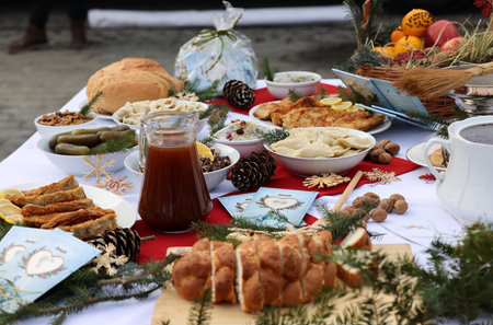 Christmas food on the table decorating with a white tableclothの写真素材
