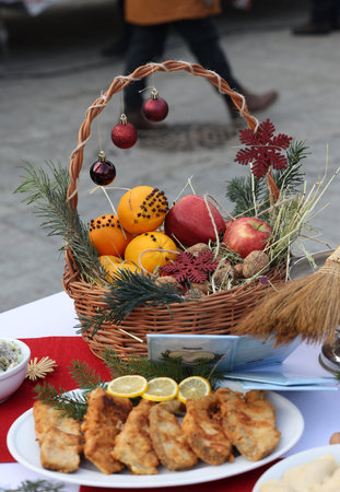 A beautifully decorated wicker basket full of fruitの写真素材