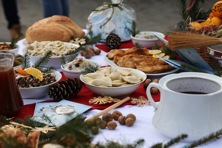 Christmas food on the table decorating with a white tableclothの写真素材