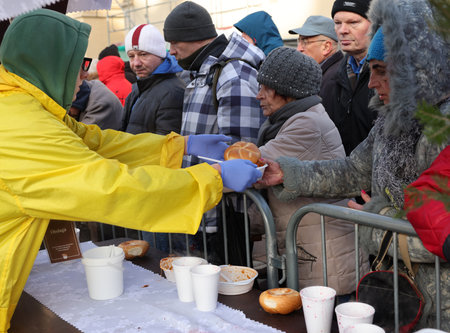 Krakow, Poland - Dec 17, 2023: Christmas Eve for the poor and homeless on the Main Square in Cracow. The group Kosciuszko prepares the greatest eve in the open air in Krakowのeditorial素材