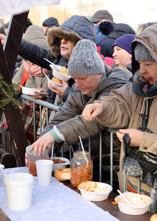 Krakow, Poland - Dec 17, 2023: Christmas Eve for the poor and homeless on the Main Square in Cracow. The group Kosciuszko prepares the greatest eve in the open air in Krakowのeditorial素材