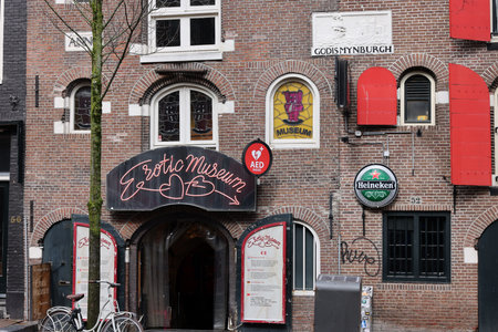 Amsterdam, Netherlands - April 21, 2023: De Wallen - called the red light district. It is famous for its entertainment character: brothers, coffee shops, pubs and restaurants located along the canalsのeditorial素材