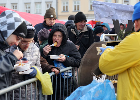 Krakow, Poland - Dec 17, 2023: Christmas Eve for the poor and homeless on the Main Square in Cracow. The group Kosciuszko prepares the greatest eve in the open air in Krakowのeditorial素材