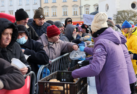 Krakow, Poland - Dec 17, 2023: Christmas Eve for the poor and homeless on the Main Square in Cracow. The group Kosciuszko prepares the greatest eve in the open air in Krakowのeditorial素材
